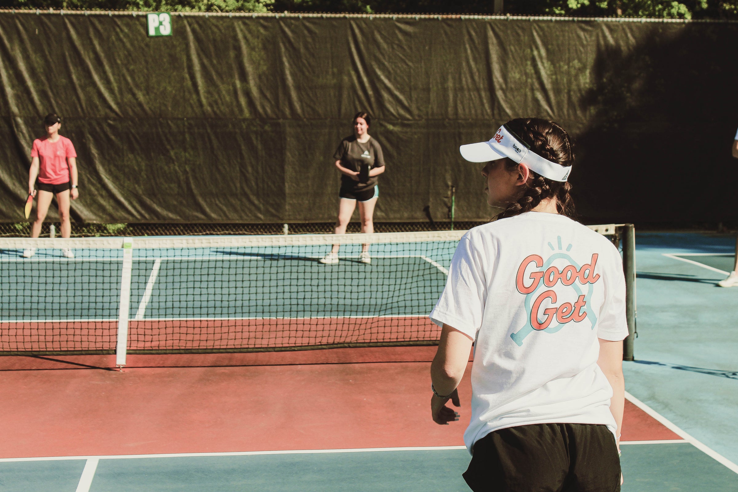 Ladies enjoying a game of pickleball in their Good Get Apparel